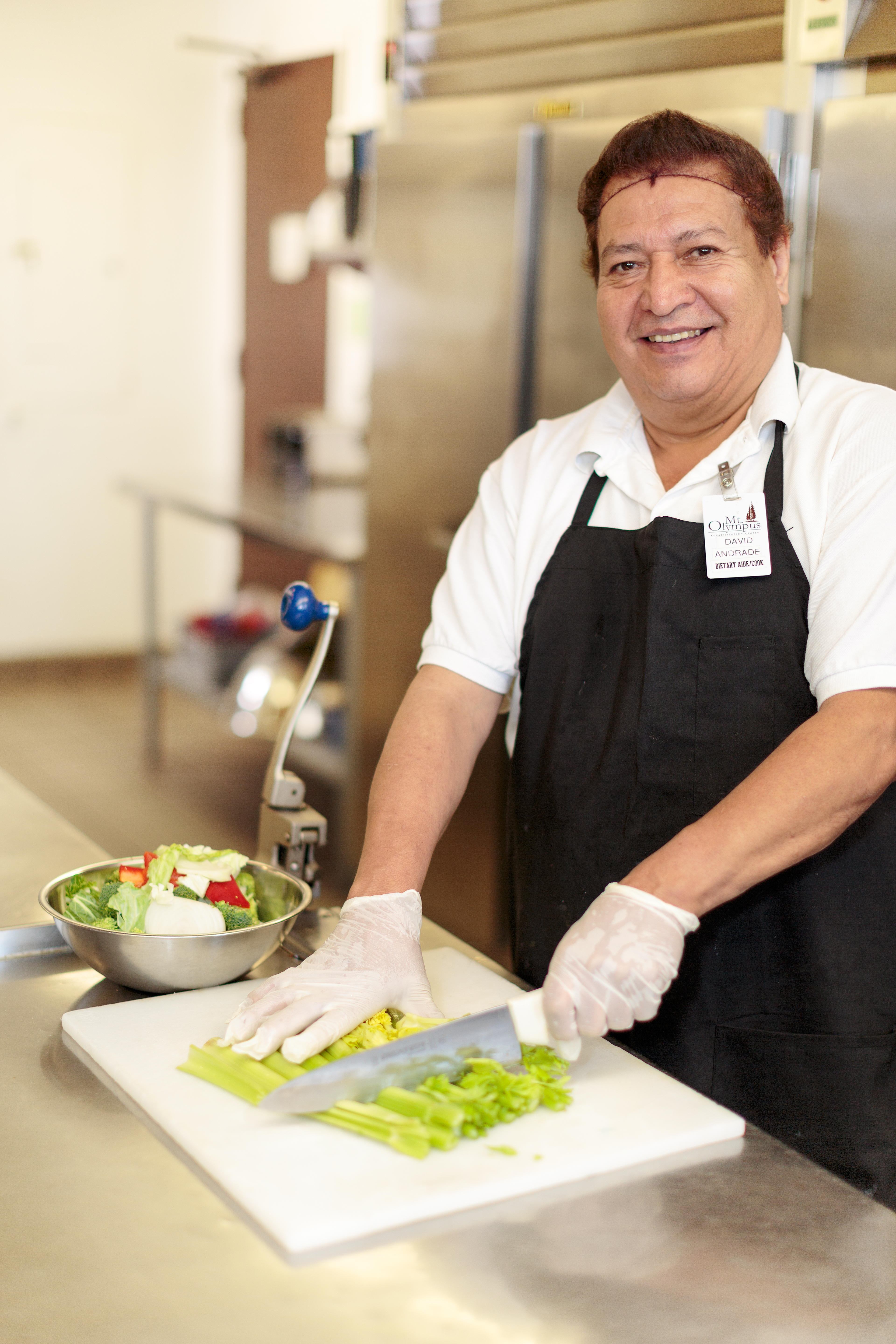 Dietary aide David Andrade preparing fresh food